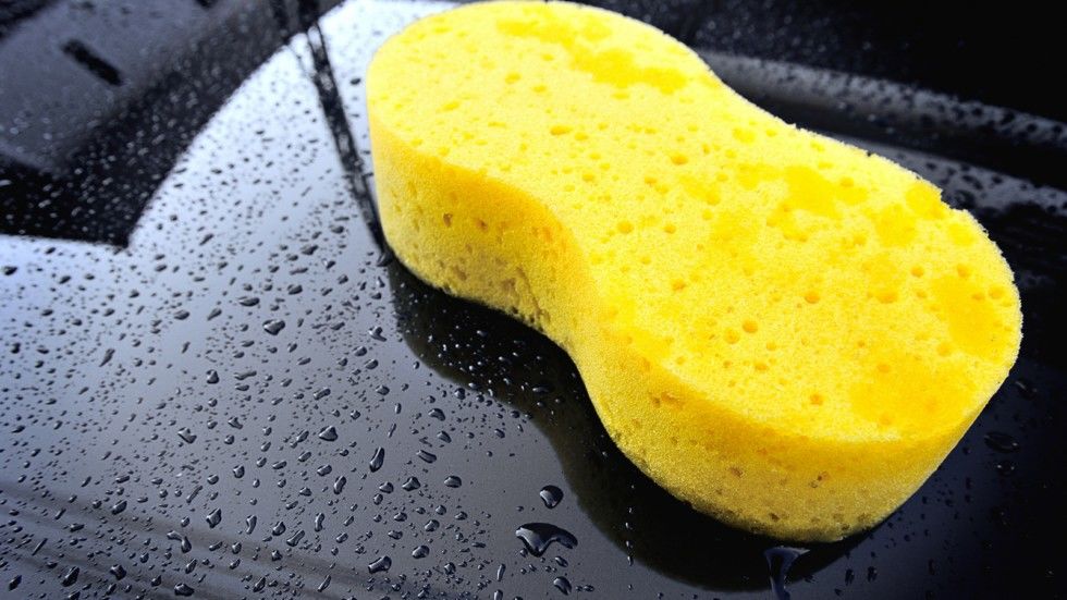 yellow sponge on the black car