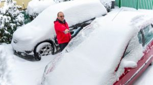 shoveling snow in winter